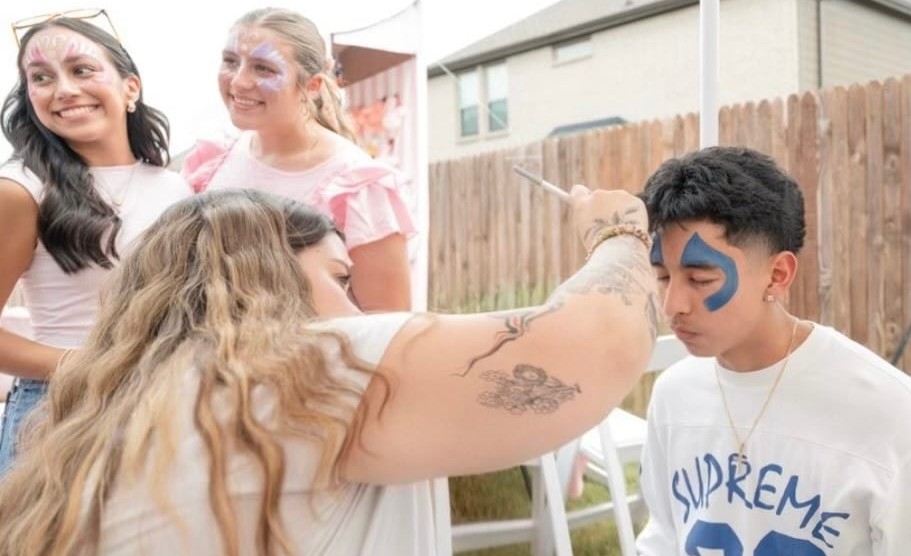 Kids face painting at a Texas birthday party