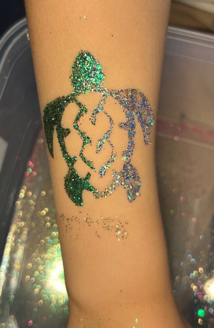 Glitter turtle tattoo design at a Texas kids party